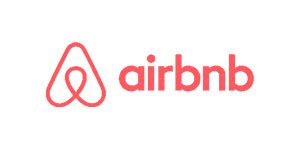 A red and white logo for airbnb.