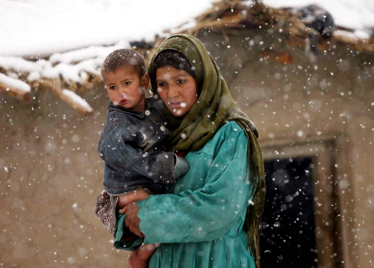 A woman holding a child in her arms.